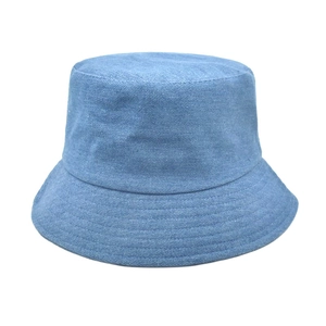 Detailed view of reinforced stitching on brim of light blue denim bucket sun hat