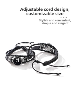 Adjustable black braided rope bracelet with metallic beads and letter A charm detail