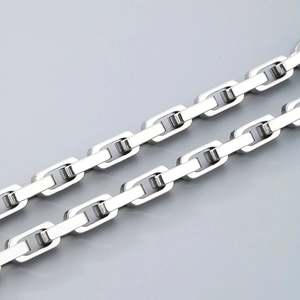Macro shot of silver titanium steel square link chain showing thick geometric texture
