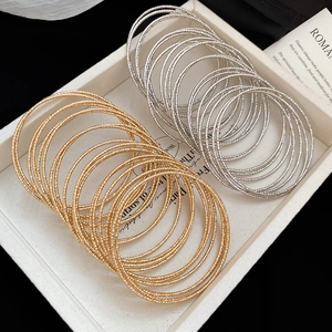 20-piece bohemian style stackable metal bangles set with sparkling diamond cut texture