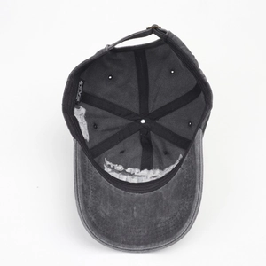 Detail of the inner structure of a washed cotton baseball cap with adjustable buckle