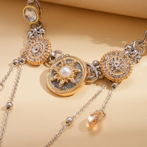 Detailed close-up of vintage baroque necklace with sunburst pendant and crystal fringe