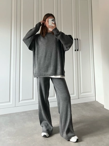 Women's dark grey knit set with loose crewneck sweater and wide-leg trousers