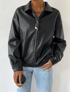 Close-up of black leather jacket details showing high-quality zipper and lapel texture
