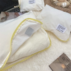 Detail of waterproof travel storage bag with white nylon fabric and yellow zipper