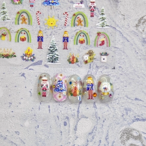Detailed Christmas nail stickers featuring Nutcracker, trees, and gift patterns on nails