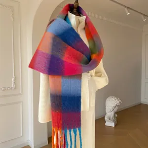 Chic gradient checkered shawl scarf with tassels styled on a white knit sweater
