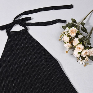 Detail of black halter top with silver glitter stripes and tie-back cutout design