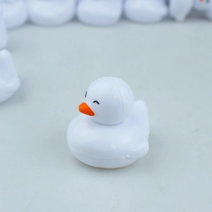 Realistic white mini duck model toy with orange beak and closed-eye smiling expression