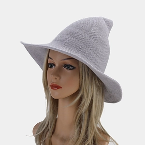 Macro shot of grey knitted witch hat texture and pointed top design on model
