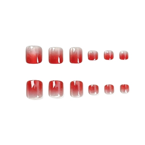 Faux ongles d'orteils carrés courts avec dégradé rouge et effet œil de chat scintillant
