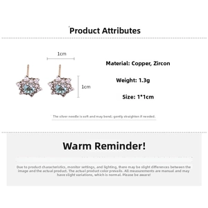 Detail view of silver pin snowflake earrings with blue zircon stones and size specifications