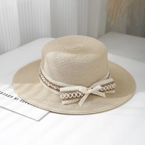 Classic beige flat top straw boater hat with elegant white lace ribbon and bow decoration