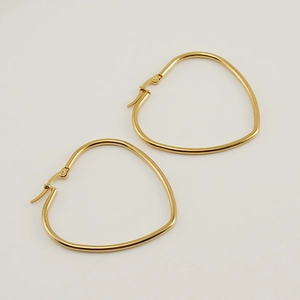 Exaggerated minimalist 18K gold heart-shaped stainless steel earrings on white background
