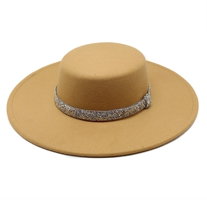 Detail of camel wool fedora with gold and silver rhinestone band on flat brim