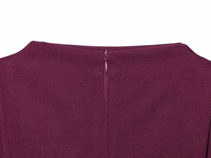 Detailed macro view of invisible back zipper on deep purple pleated shoulder top