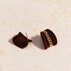 Detail of dark brown velvet semi-circle earrings with gold chain trim and ear pin