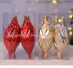 Lot d'ornements de Noël en forme de stalactites rouges et dorées dans leur boîte cadeau