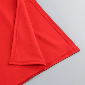 Detail of high-density stitching and overlock edge on this red bodycon evening dress