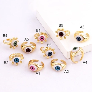 Collection of ten gold evil eye adjustable rings in colorful enamel styles A and B
