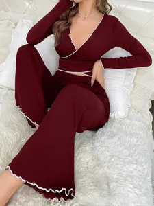 Detail of burgundy ribbed lounge set with V-neck wrap top and white wavy lettuce edges