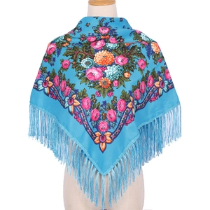 Ethnic 90x90 square blue floral silk scarf with elegant tassels on a female model