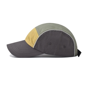 Three-color patchwork cotton baseball cap in olive green, yellow, and grey with side vents