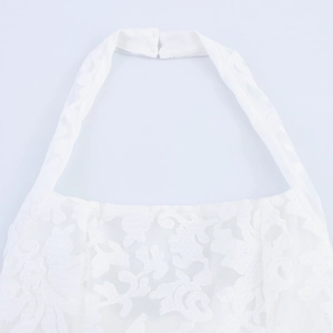 Elegant white halter neck lace maxi dress featuring floral embroidery and backless design