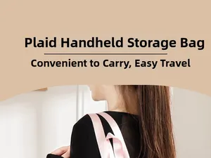 Detail of pink nylon handle on a plaid storage bag carried by a woman for travel use