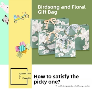 Grey gift bag collection with white floral illustrations and satin ribbon bow handles