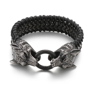 Men's vintage braided leather bracelet with dual stainless steel wolf heads and ring clasp