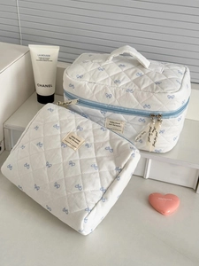 Blue bow print quilted makeup bag set with large travel pouch and small flat pouch