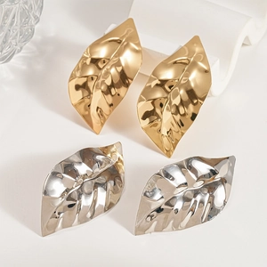 Metallic leaf drop earrings in gold and silver finish with textured organic pattern