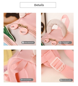 Detail view of pink kids backpack showing double zippers, soft handle, and adjustable buckles