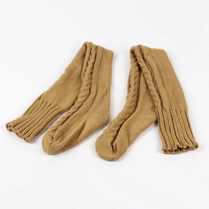 Detail of camel knit leg warmers showing textured cable stitch pattern and ribbed cuffs