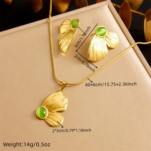 Vintage gold butterfly jewelry set with green opal pendant necklace and earrings