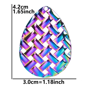 Detailed view of teardrop earring accessory with braided texture and 18k gold plating