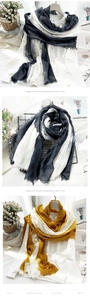 Detail of soft cotton linen scarves with gradient dip-dye effect and fringed edges