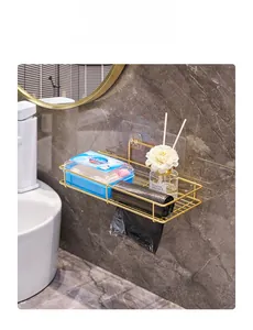 Close-up of wall-mounted gold metal shelf with grid design on marble bathroom wall