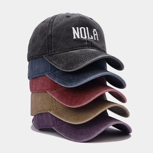 Distressed cotton baseball caps with NOLA embroidery in five assorted colors