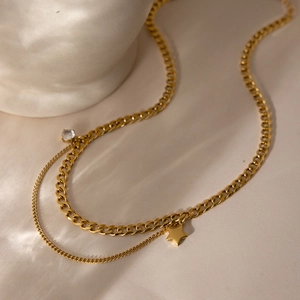 Double-layered gold stainless steel necklace with star pendant and cubic zirconia