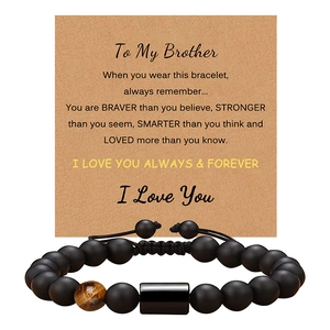 Detail of adjustable matte black onyx and tiger eye bead bracelet on gift message card
