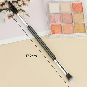Dual-ended 17.2cm makeup brush with spoolie and blending head on black wooden handle