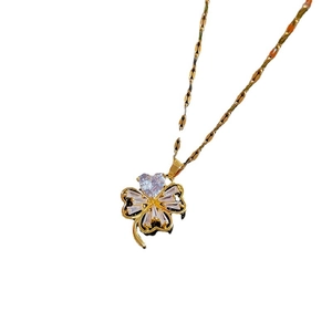 Elegant gold clover necklace with full zircon pavé crystals on a minimalist lip chain