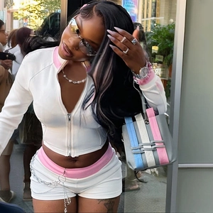 Women's white and pink slim fit zip-up tracksuit set with long sleeve top and matching shorts
