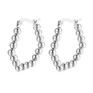 Minimalist silver stainless steel hoop earrings with a textured small bead circle design