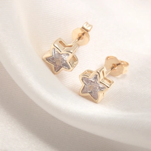 Fashionable gold-plated star stud earrings with sparkling cubic zirconia on silk