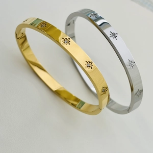 Minimalist 18K gold and silver stainless steel bangles with CNC set star patterns