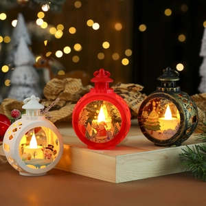 Three Christmas lanterns with Santa, snowman and tree scenes with warm LED glow