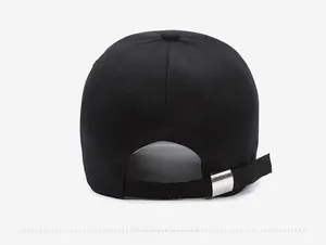 Detail of baseball cap back showing black adjustable strap and silver metal buckle